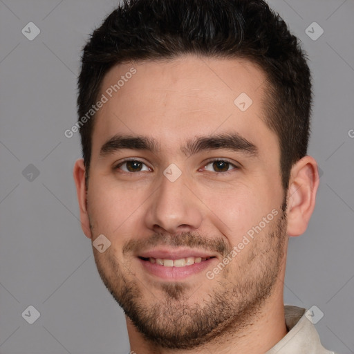 Joyful white young-adult male with short  brown hair and brown eyes