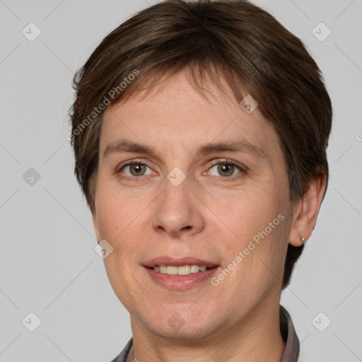 Joyful white adult male with short  brown hair and grey eyes