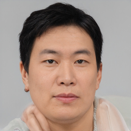 Neutral asian young-adult male with short  brown hair and brown eyes