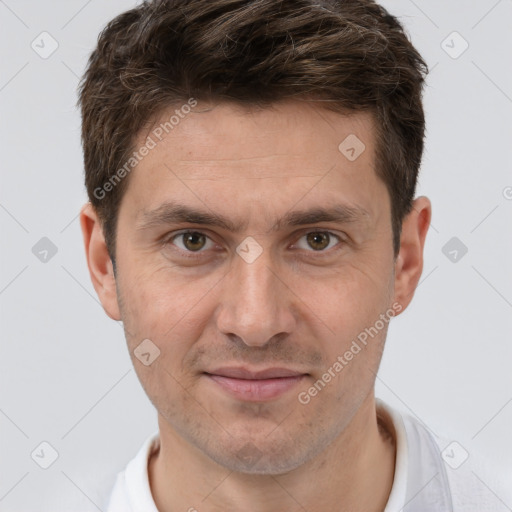 Joyful white adult male with short  brown hair and brown eyes