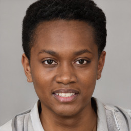 Joyful black young-adult female with short  black hair and brown eyes