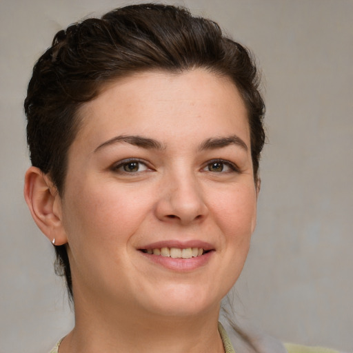 Joyful white young-adult female with medium  brown hair and brown eyes