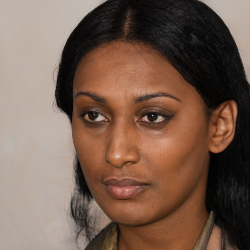 Neutral black young-adult female with medium  black hair and brown eyes