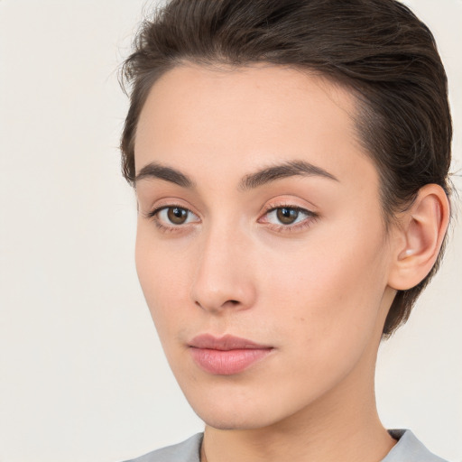 Neutral white young-adult female with medium  brown hair and brown eyes