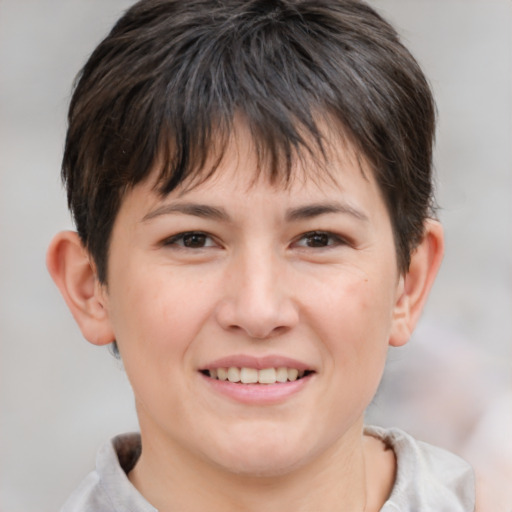 Joyful white young-adult female with short  brown hair and brown eyes