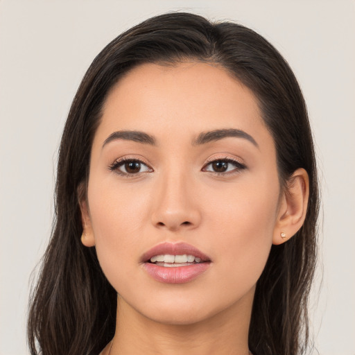 Joyful white young-adult female with long  brown hair and brown eyes