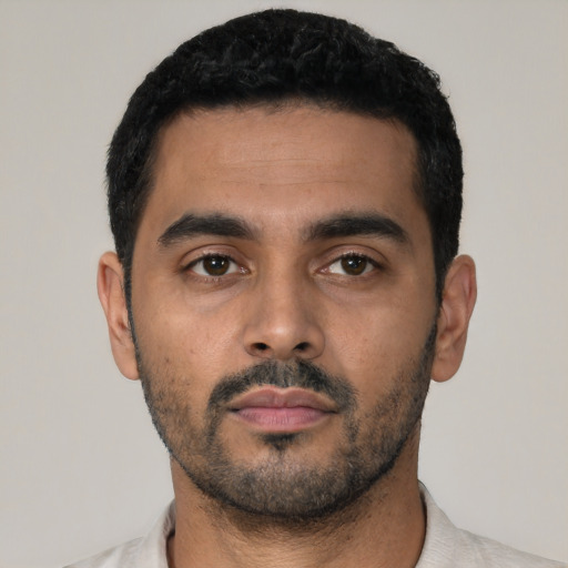 Neutral latino young-adult male with short  black hair and brown eyes