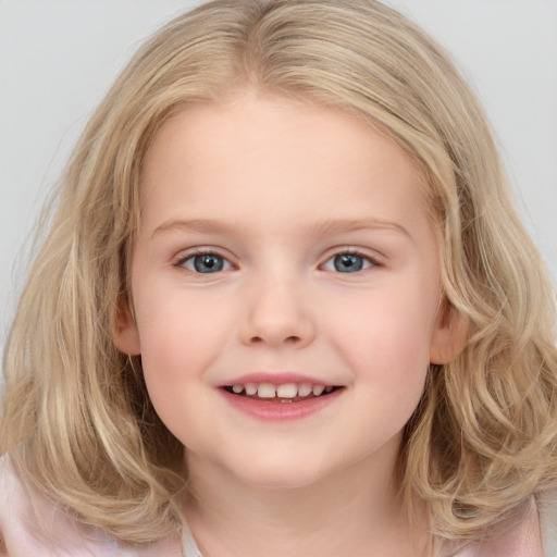 Joyful white child female with medium  brown hair and blue eyes