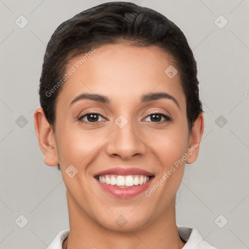 Joyful latino young-adult female with short  brown hair and brown eyes