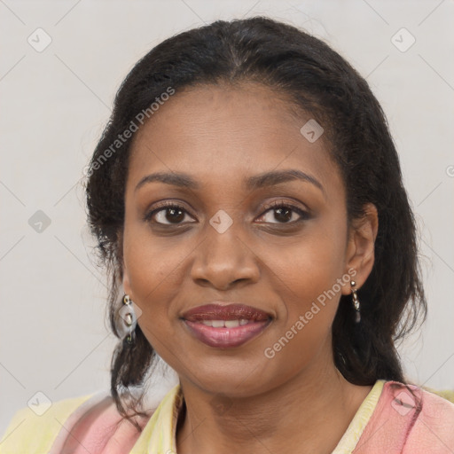 Joyful black young-adult female with long  brown hair and brown eyes