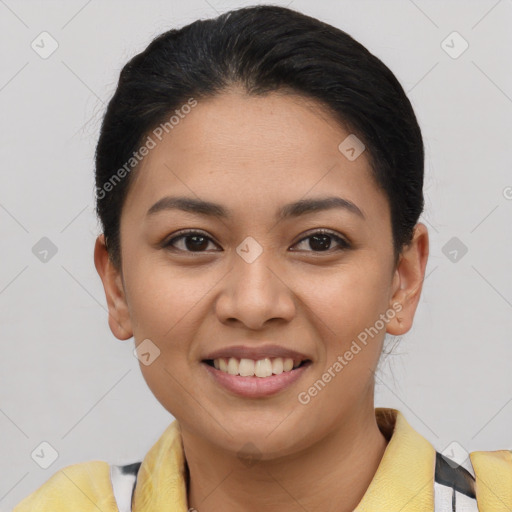 Joyful latino young-adult female with short  brown hair and brown eyes