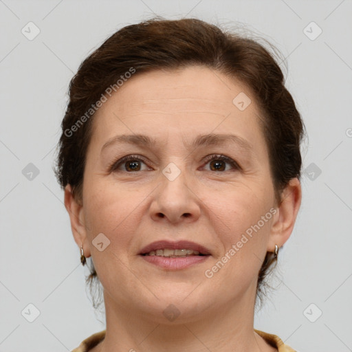 Joyful white adult female with short  brown hair and brown eyes