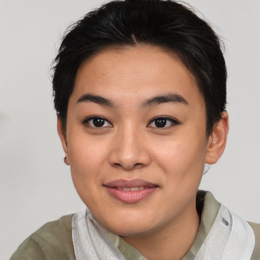 Joyful asian young-adult female with short  brown hair and brown eyes