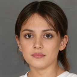 Neutral white young-adult female with medium  brown hair and brown eyes