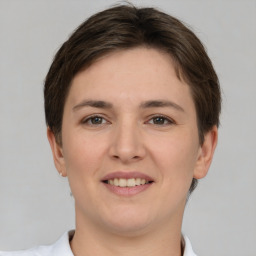 Joyful white young-adult female with short  brown hair and brown eyes