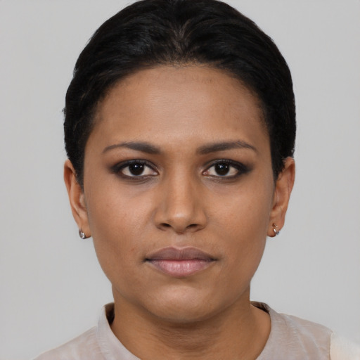 Joyful asian young-adult female with short  black hair and brown eyes