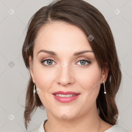 Joyful white young-adult female with medium  brown hair and green eyes