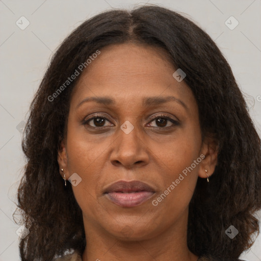 Joyful black adult female with medium  brown hair and brown eyes