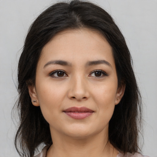 Joyful asian young-adult female with medium  brown hair and brown eyes