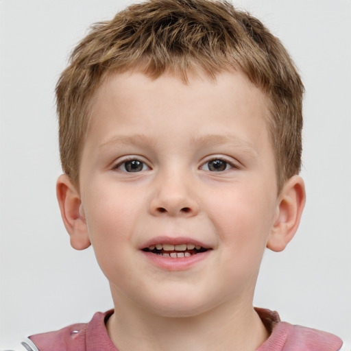 Joyful white child male with short  brown hair and grey eyes