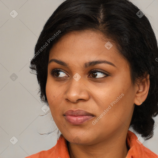 Joyful latino young-adult female with medium  brown hair and brown eyes