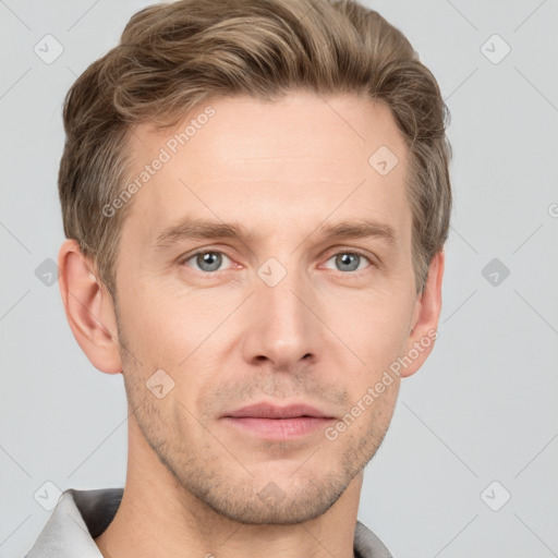 Joyful white adult male with short  brown hair and grey eyes