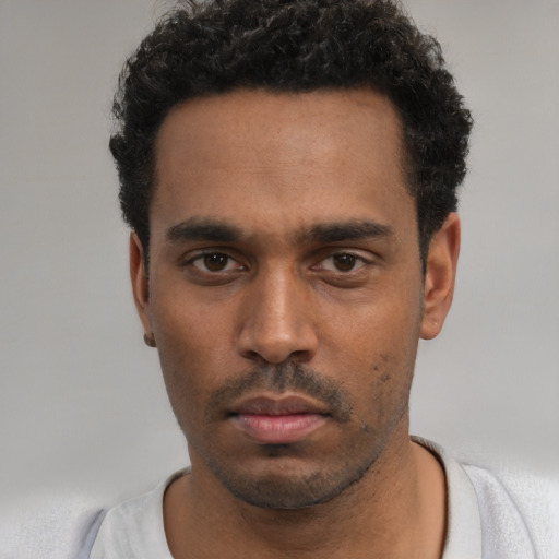 Neutral black young-adult male with short  black hair and brown eyes