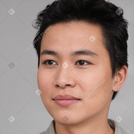 Joyful asian young-adult male with short  brown hair and brown eyes