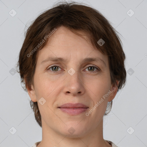 Joyful white young-adult female with medium  brown hair and green eyes