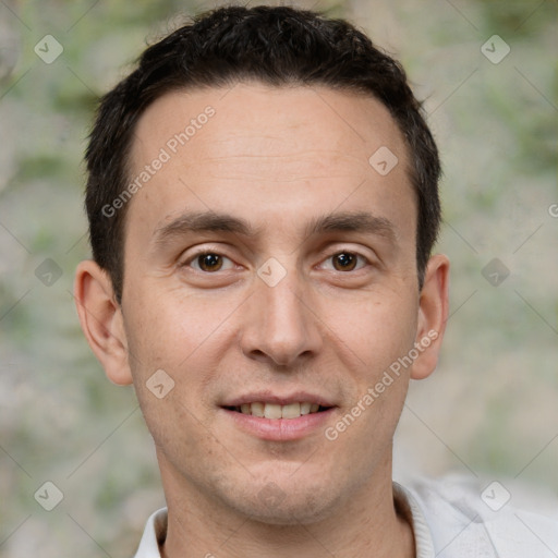 Joyful white adult male with short  brown hair and brown eyes