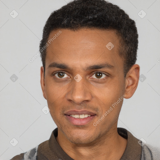 Joyful black young-adult male with short  black hair and brown eyes