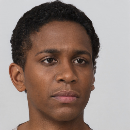 Neutral black young-adult male with short  brown hair and brown eyes