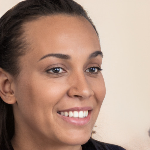 Joyful white young-adult female with long  brown hair and brown eyes