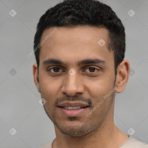 Joyful white young-adult male with short  black hair and brown eyes