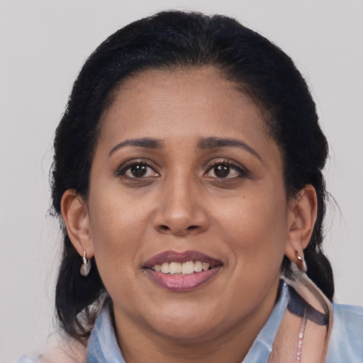 Joyful asian adult female with medium  brown hair and brown eyes