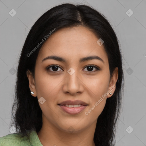 Joyful latino young-adult female with long  brown hair and brown eyes