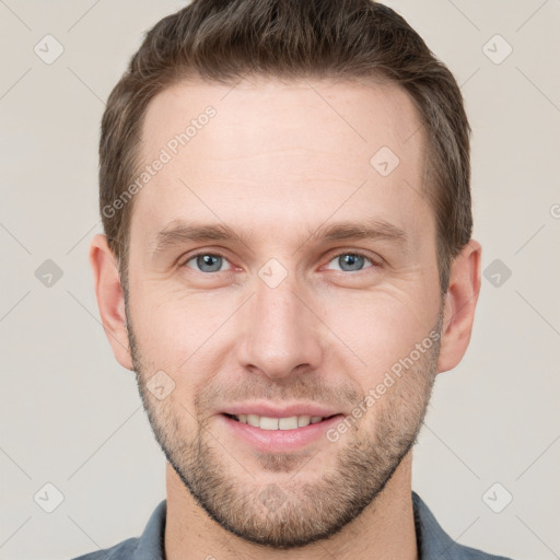 Joyful white young-adult male with short  brown hair and grey eyes