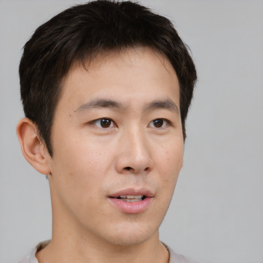 Neutral asian young-adult male with short  brown hair and brown eyes