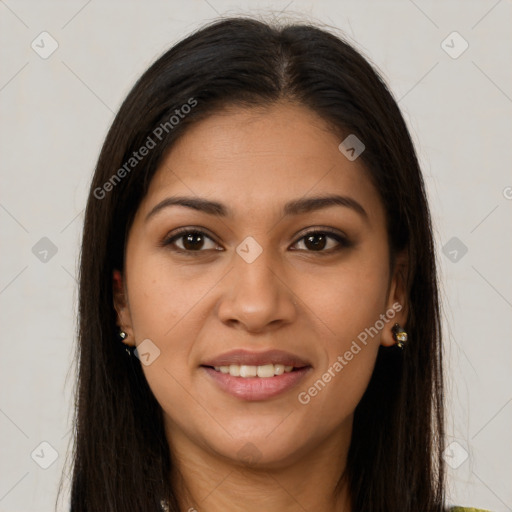 Joyful latino young-adult female with long  brown hair and brown eyes