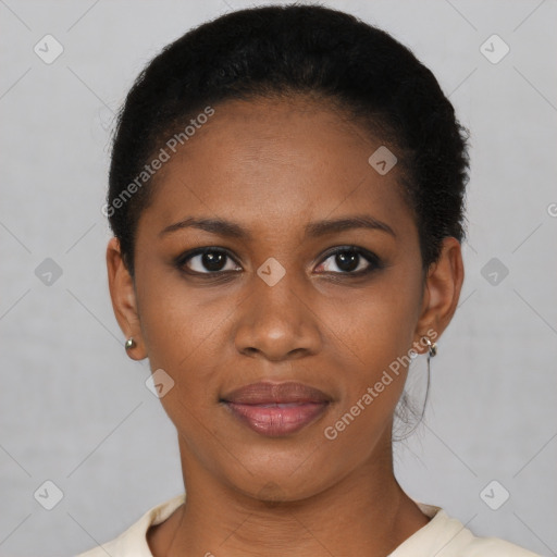 Joyful black young-adult female with short  black hair and brown eyes