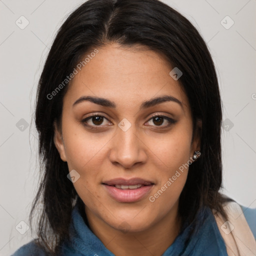 Joyful latino young-adult female with long  brown hair and brown eyes