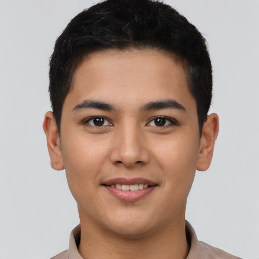 Joyful asian young-adult male with short  brown hair and brown eyes