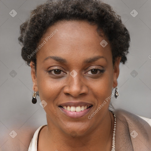 Joyful black young-adult female with short  brown hair and brown eyes