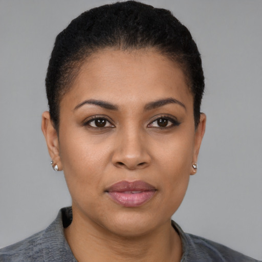 Joyful latino young-adult female with short  brown hair and brown eyes