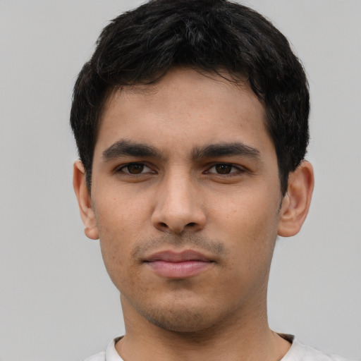 Neutral latino young-adult male with short  black hair and brown eyes