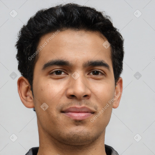 Joyful latino young-adult male with short  brown hair and brown eyes