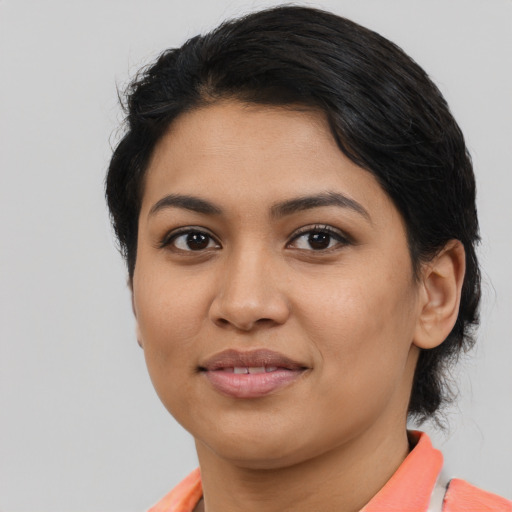 Joyful asian young-adult female with medium  black hair and brown eyes