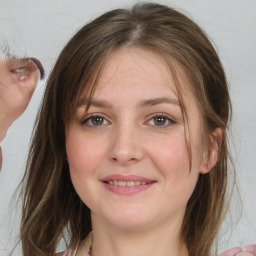 Joyful white young-adult female with medium  brown hair and blue eyes