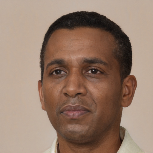 Neutral black adult male with short  black hair and brown eyes