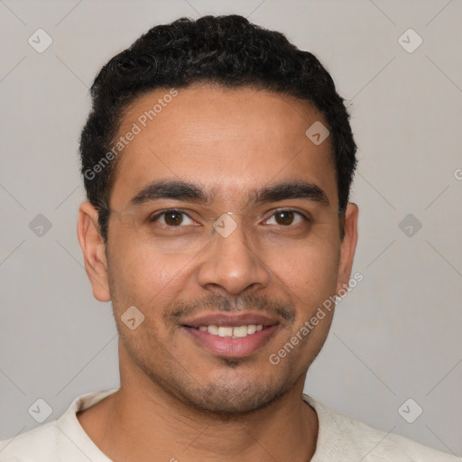 Joyful latino young-adult male with short  black hair and brown eyes